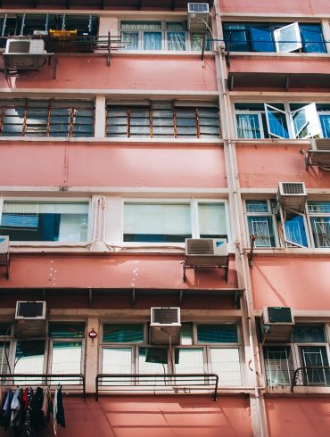 low-angle photography of red building