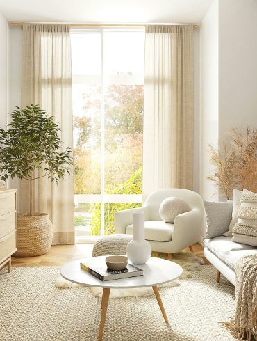 white and gray sofa chair near window